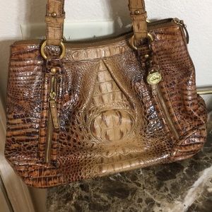 A beautiful women handbag color is brown and tan, good Conditions.